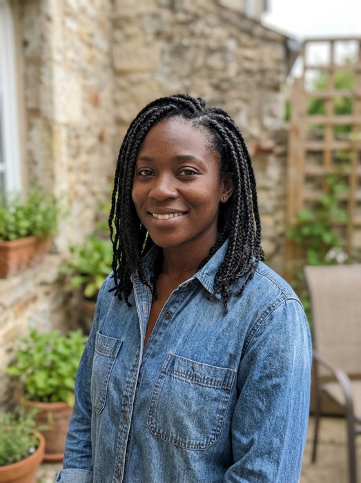 Customer photo: Woman with braided hair in a denim shirt