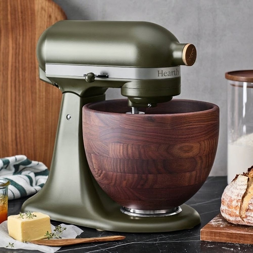 Product photo: an olive stand mixer with a walnut bowl
